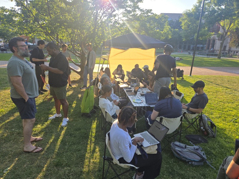 Coding meetup under a tent in Joan Lorentz Park